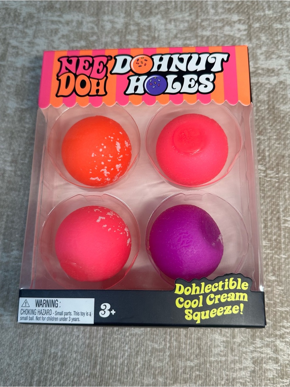 Schylling NeeDoh Donut Holes 4 pack Stress Balls - Pink, Orange & Purple